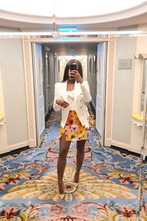 Stunning black girl taking a selfie in a colourful hotel hallway