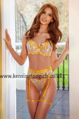 20 year old escort Hot blond with flat chest in lacey yellow lingerie